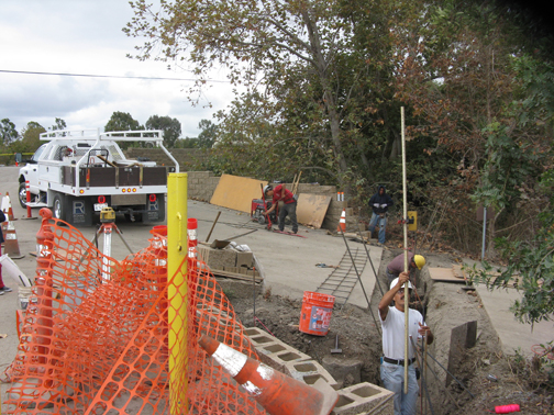 Workers installing a gate.